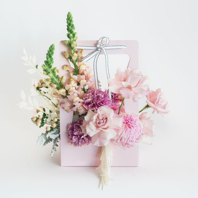 Jo - Stylish Carry Box Arrangement Of Pastel Pink Flowers