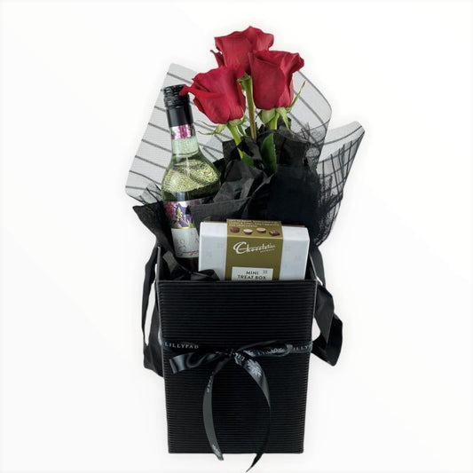 Gift basket with red roses, a bottle of champagne, and a box of chocolates romantic send to her at work same day florist melbourne