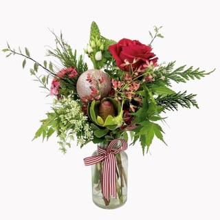 Small mason jar featuring sim carnations, succulent, chincherinchee, preserved red hydrangea, red hypericum, lisianthus and chrysanthemum.