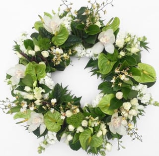 White and green funeral wreath featuring orchids and anthuriums, Melbourne delivery only.