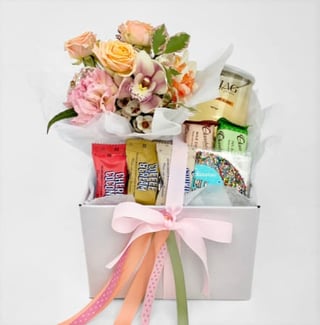 Pretty petite posy of seasonal pastel blooms with wine and assorted chocolatier chocolates, same day Melbourne delivery