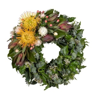 Native funeral wreath featuring orange pincushions leacadendrons and seasonal natives. Melbourne and Australia wide delivery with Interflora Flowers.