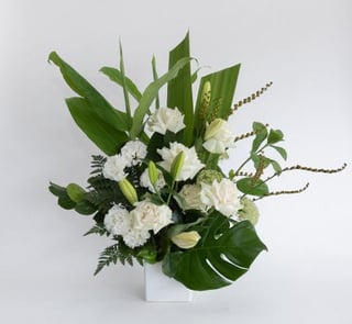 Classic white and green flower arrangement featuring lilies, roses, queen annes lace, Melbourne flower delivery.