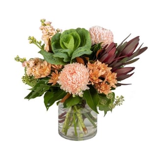 Peachy Disbuds - Soft peach disbuds, chrysanthemums, stock, kale and leucadendrons in vase. Melbourne & Australia wide delivery with Interflora Flowers