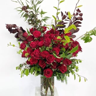 Striking large bouquet of 50 red roses in vase available for Melbourne delivery only. 2 day advance notice required or call for availability.