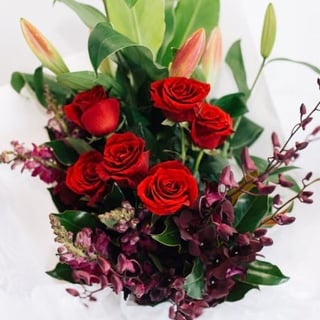 Leila - rich opulent bouquet of red roses, eggplant purple orchids, purple snapdragons and pink oriental lilies, Melbourne delivery only.
