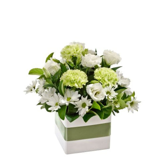 green and white flowers arrangement in a square green and white gift box sympathy melbourne florist