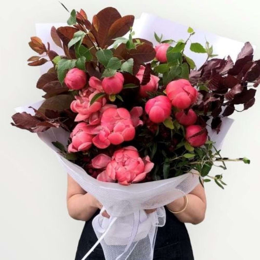 Bouquet of pink flowers with green leaves melbourne florist