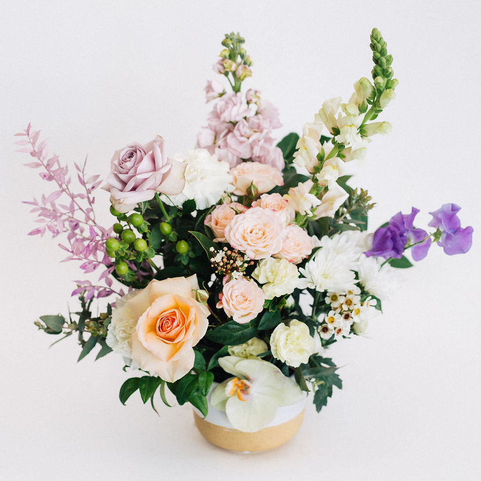Melissa - Pastel Roses and Seasonal Flower Arrangement In White Ceramic Pot