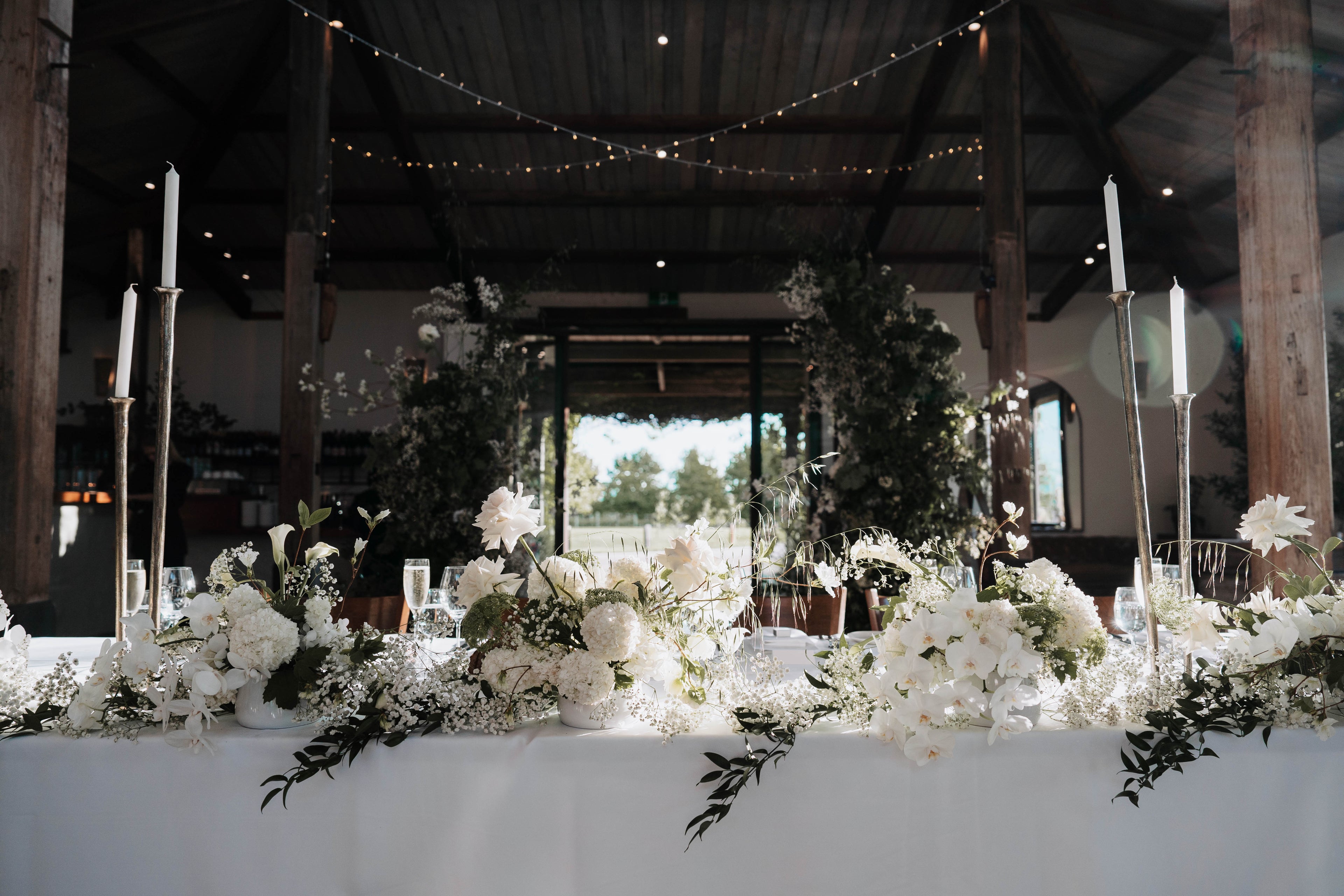 Bridal Table Flowers Baby's Breathe White Roses Calla Lilies