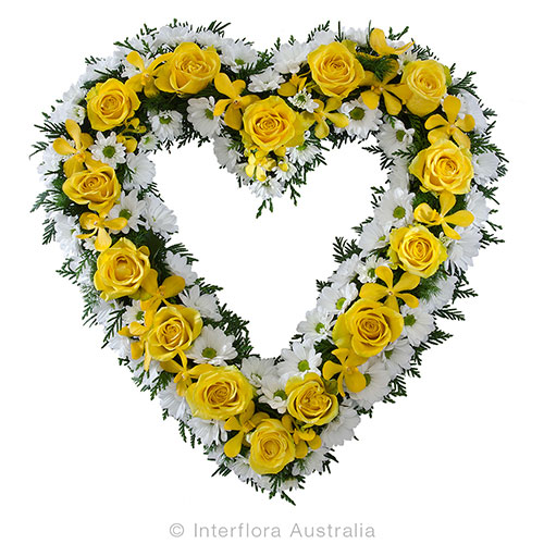Heart shaped funeral wreath in yellow and whites. Available in different colours. Melbourne same day delivery