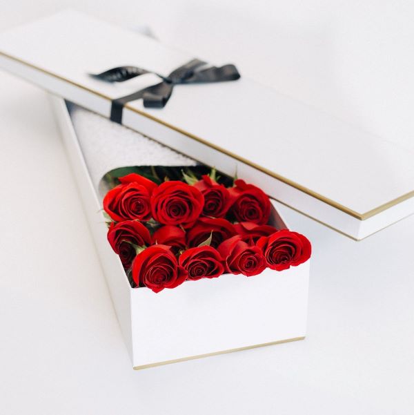 Dozen long stem red roses in premium gift box - same day delivery.