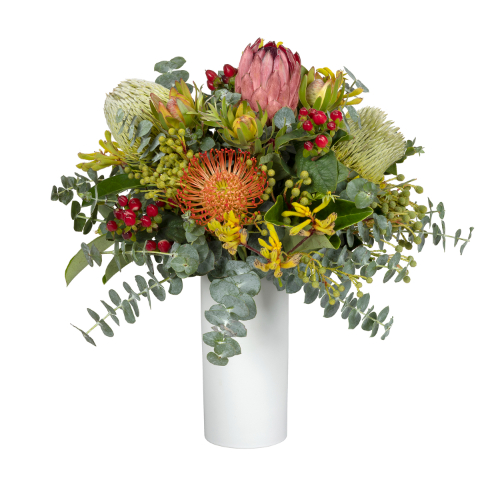 Wild nature bouquet featuring pink proteas, cream banksias, leaucadendrons in cylinder ceramic vase. Melbourne and Australia wide delivery with Interflora.