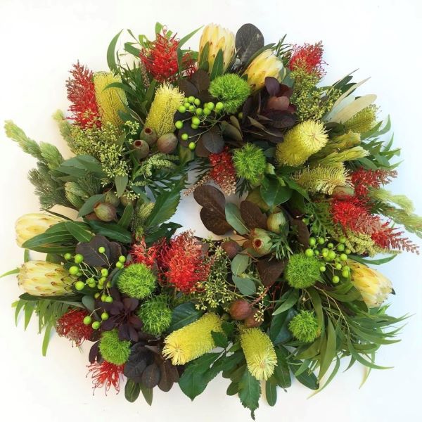 Wreath featuring proteas, banksias, gumnut and seasonal natives to compliment.