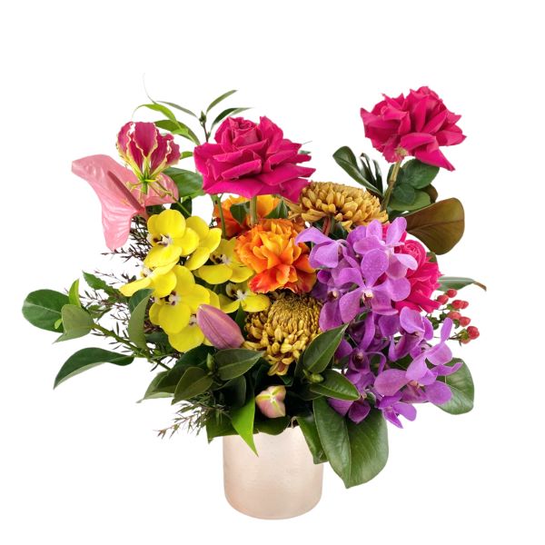 Premium orchids, roses, anthurium  beautifully arranged into a rose gold vase.