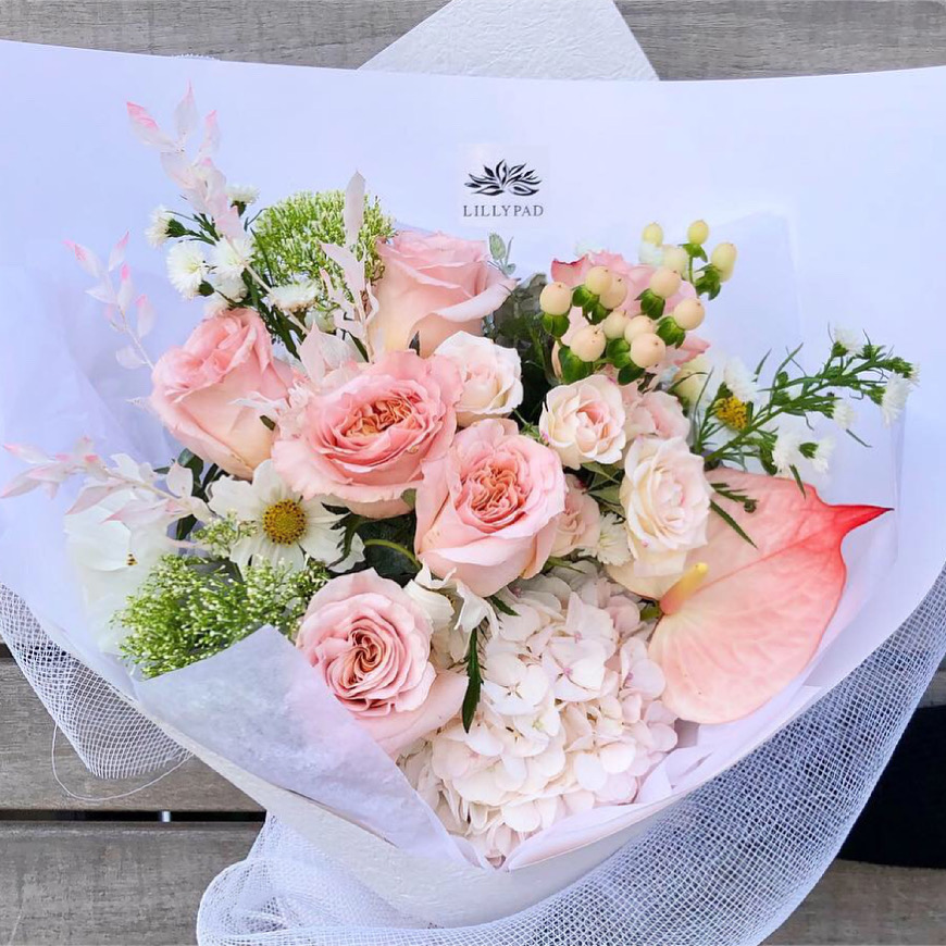 Soft pink seasonal posy to include roses, hypericum and queen annes lace with other seasonal flowers available.