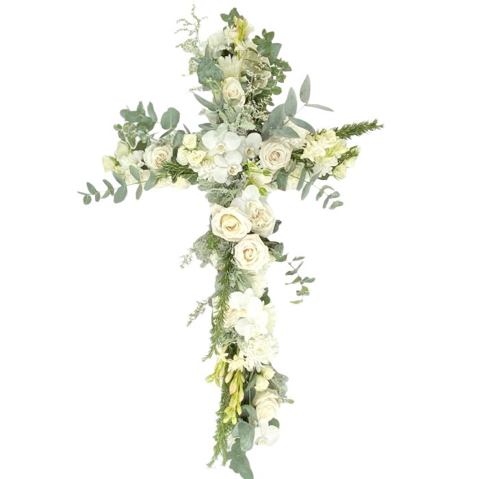White Cross featuring roses, phalaenopsis, carnations and seasonals to suit. Ideal for funerals or used for Christian wedding backdrop feature.