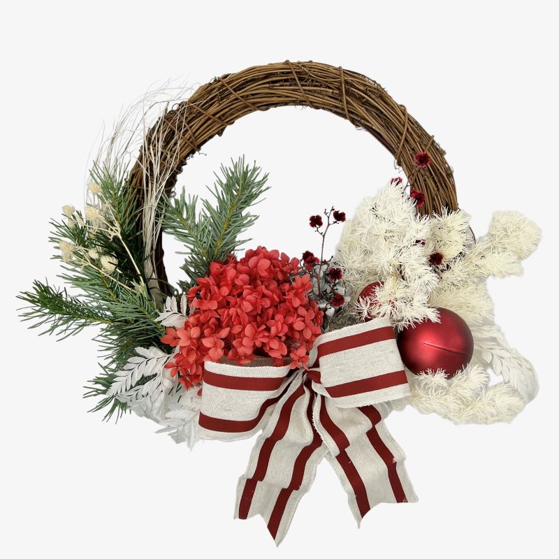 Dried willow door wreath featuring preserved red hydrangea, silver ming, white billy buttons, lunaria and red sterlingia.
