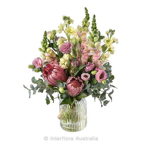 Bliss  - beautiful pink protea, lisianthus, snapdragon and stock vase arrangement