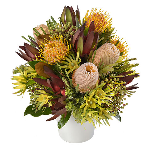 Ceramic arrangement featuring native flowers including pincushions and leucadendrons.