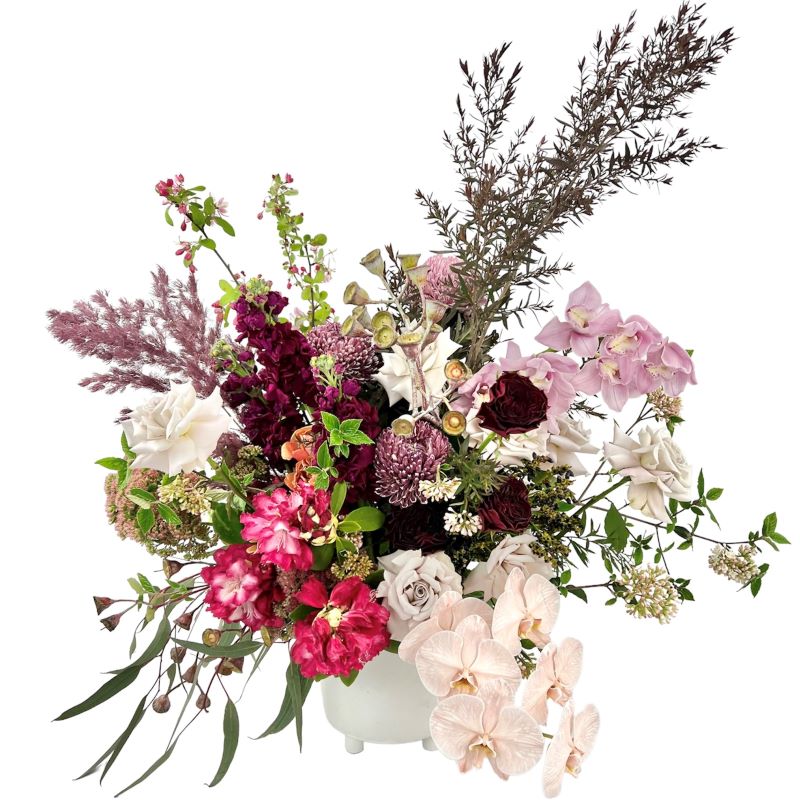 Premium Flower arrangement featuring roses, phalaenopsis, disbuds and seasonals to suit 