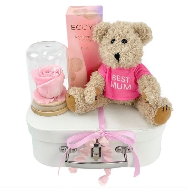 Suitcase gift hamper with preserved pink rose dome, ecoya red berry & peony diffuser, `best mum` message teddy bear.