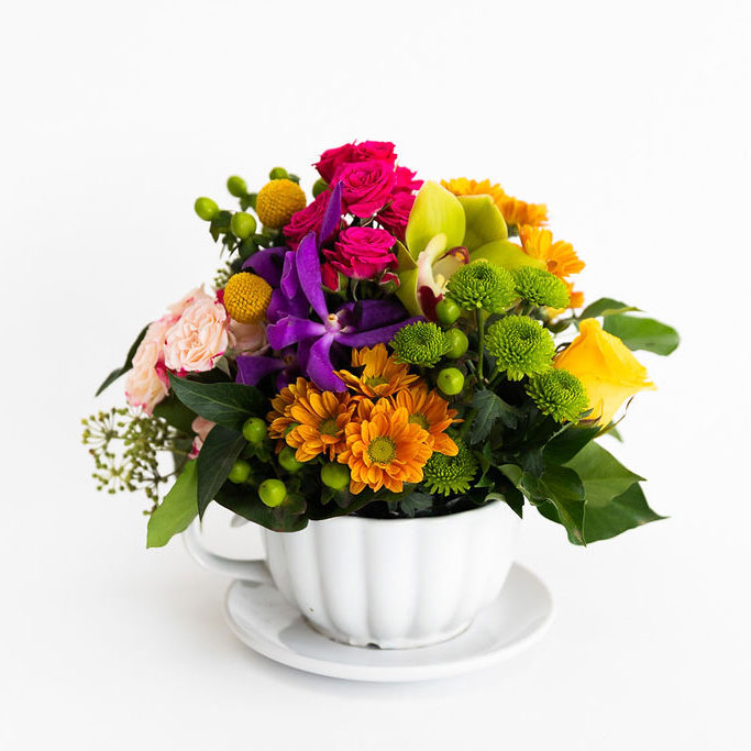 Bright colourful teacup arrangement featuring pops of colour, Melbourne flower delivery only.