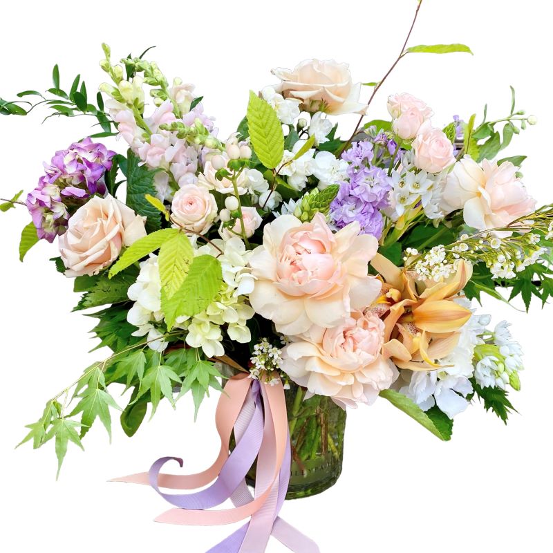 Trust our florists to select the best seasonal pastel flowers to design into a gorgeous vase arrangement.