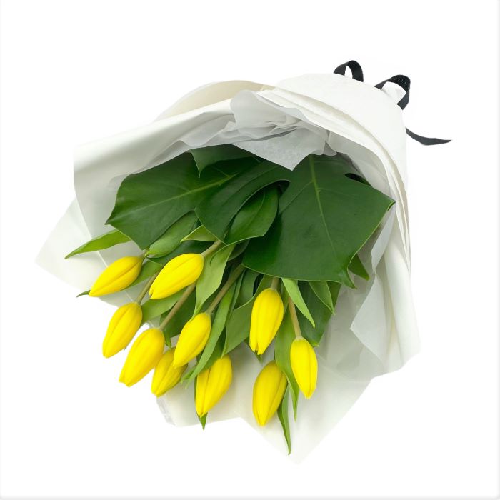 Simple gift wrapped tulips with lush greens
